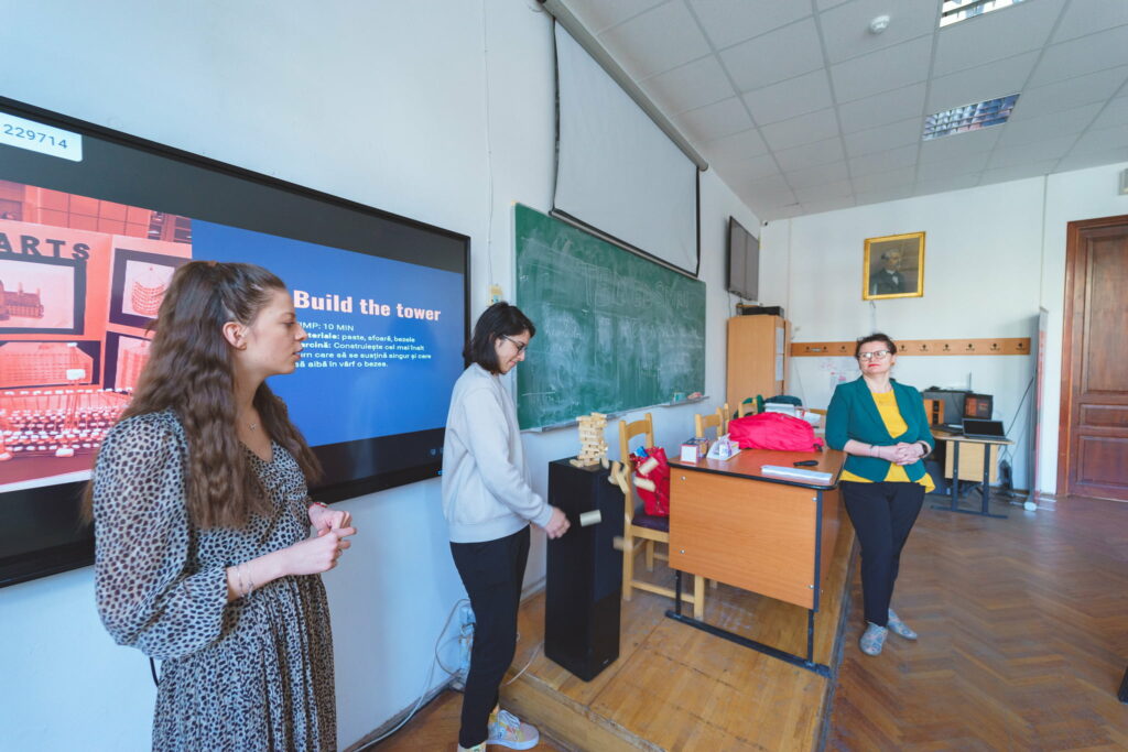 teachers and pupil demonstrate earthquake